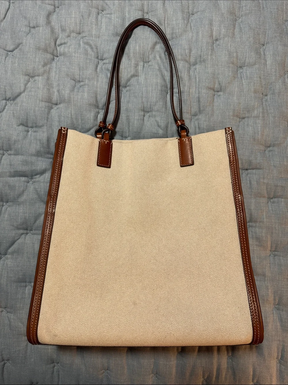 Tory Burch holds 15”
