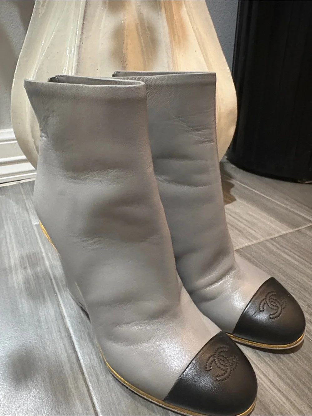 Authentic CHANEL Gray Leather Ankle Boots with Black Cap Toe