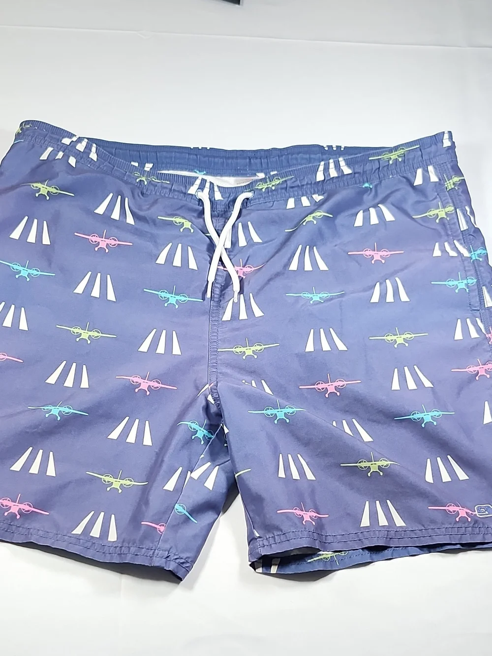 Vineyard Vines Navy Swim Trunks with Pink, Teal & Lime Plane Print