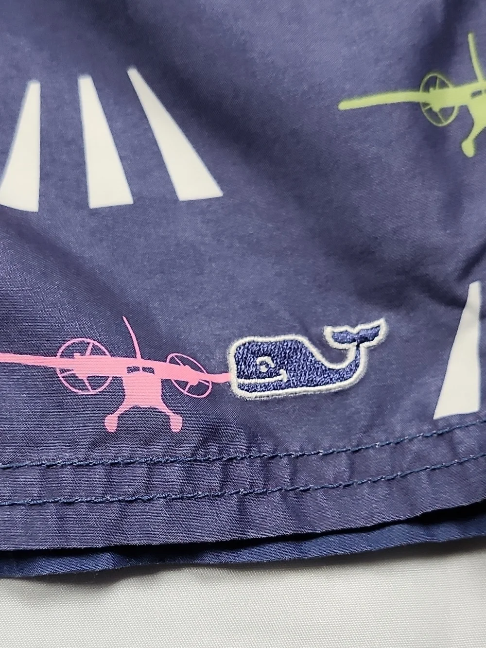 Vineyard Vines Navy Swim Trunks with Pink, Teal & Lime Plane Print