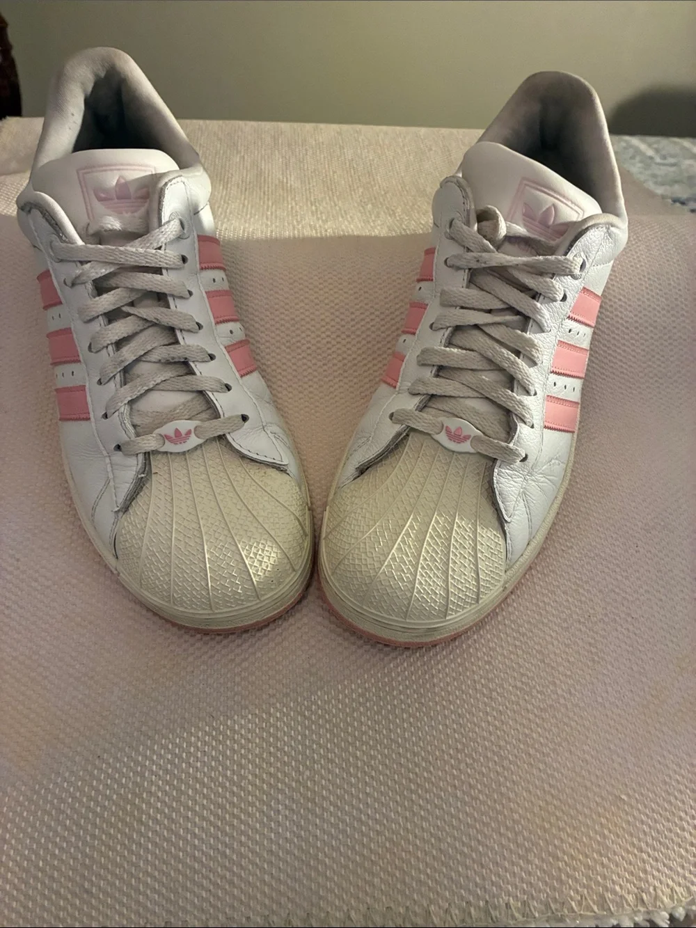 adidas Superstar White & Pink Women's Low-Top Sneakers & rubber shell toe.