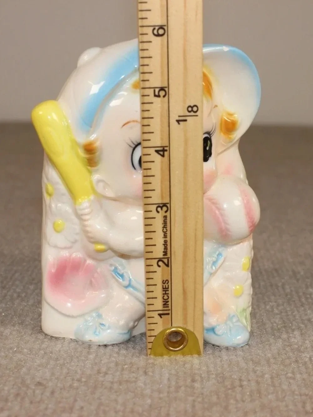 Vintage Ceramic Baby Figurine with Pastel Blue and Yellow Accents