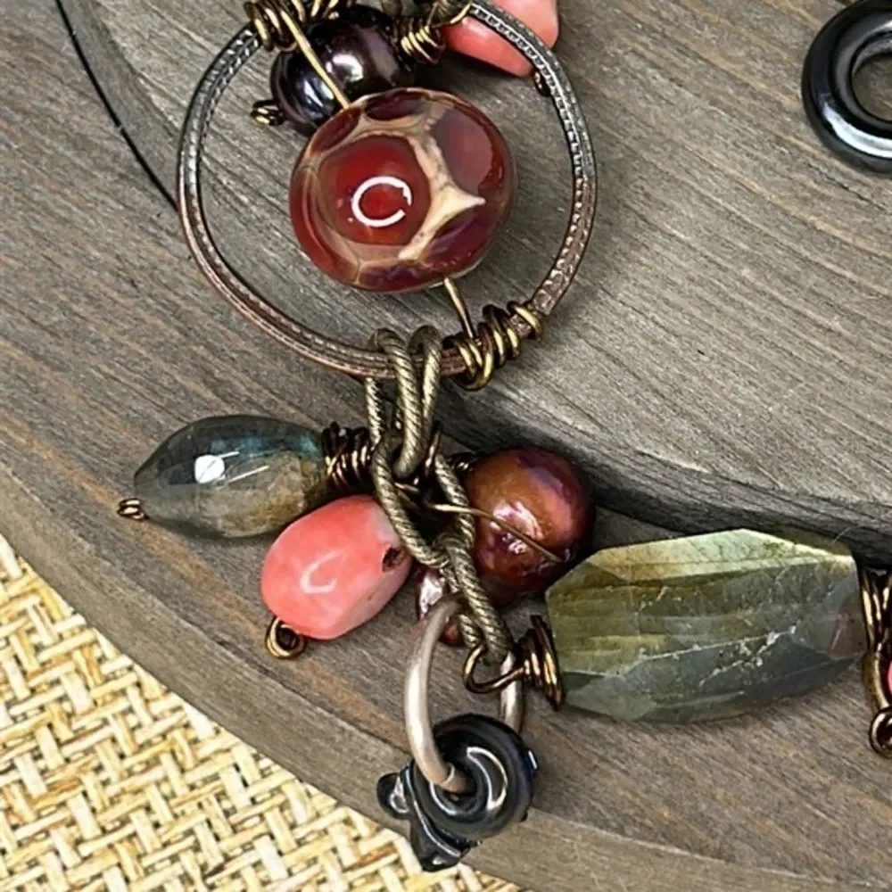 Artistic bracelet with wire wrapped stones.