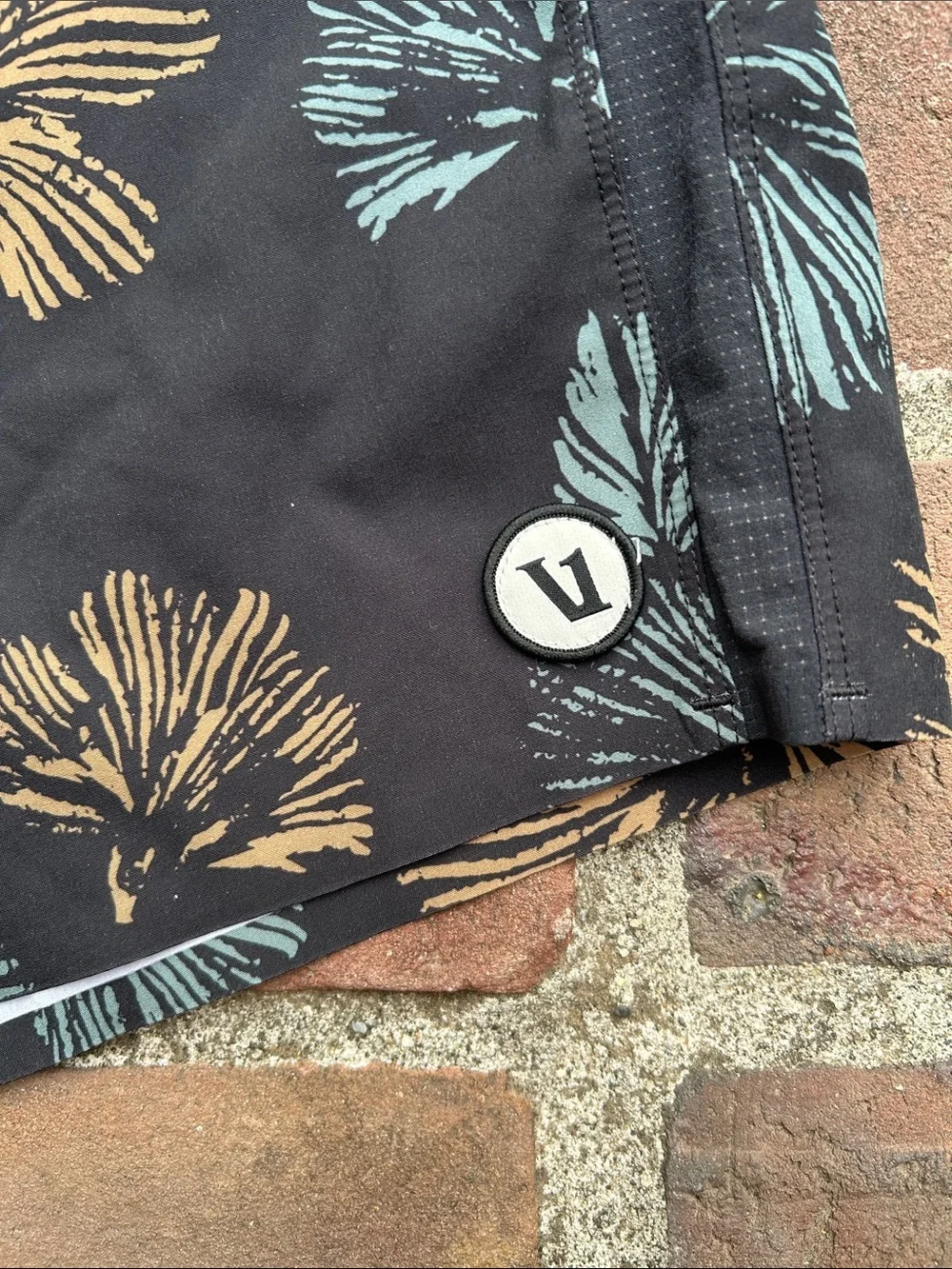 Vuori Black Swim Shorts with Teal & Tan Floral Print