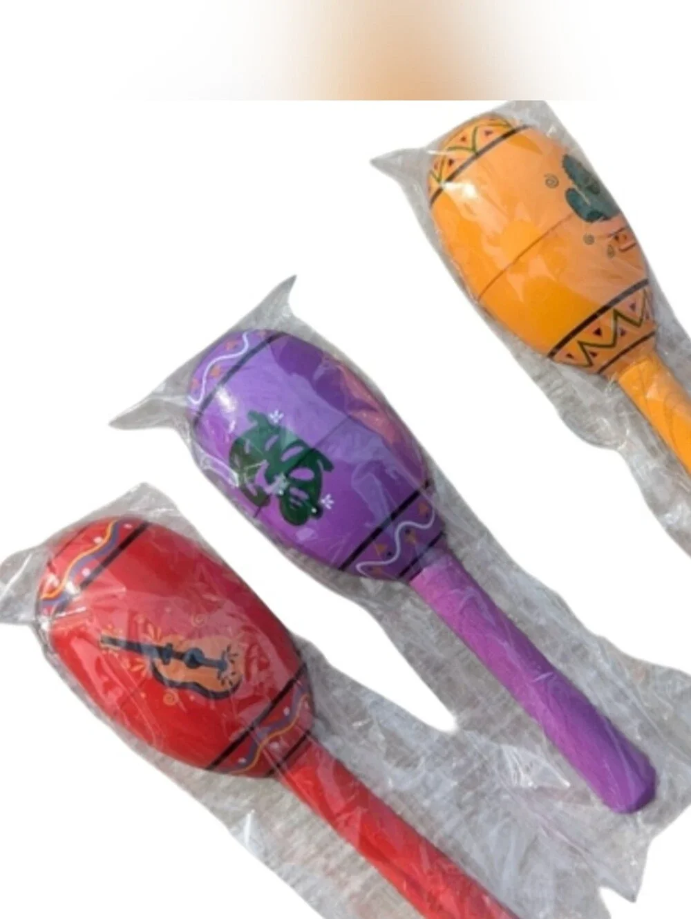 Maraca's Set Of 3. Wooden. Mini. One Red, One Orange & One Purple. Ind. Packaged