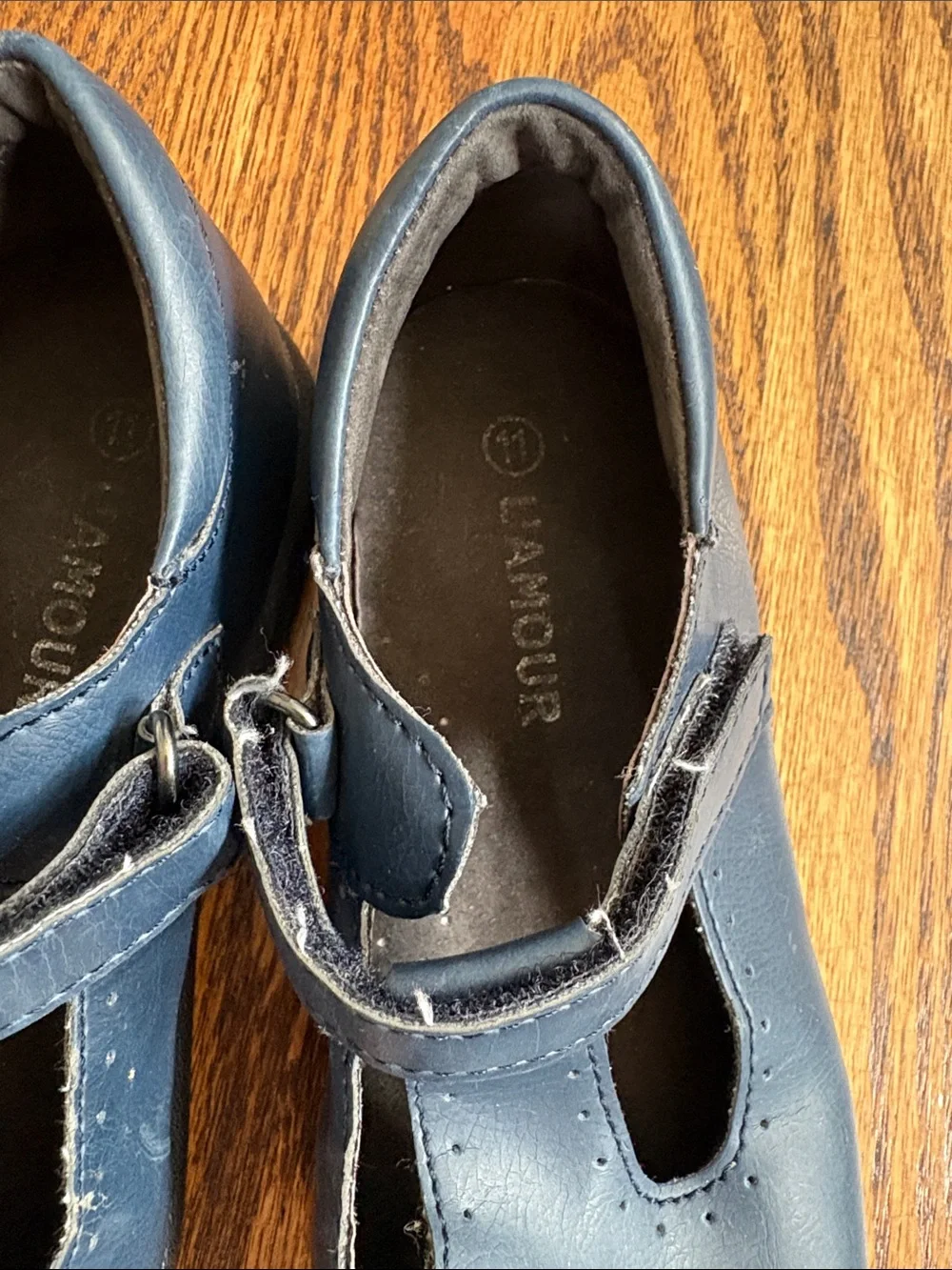 L'Amour girls navy blue with cutout pattern t-strap Mary Jane shoes, size 11.