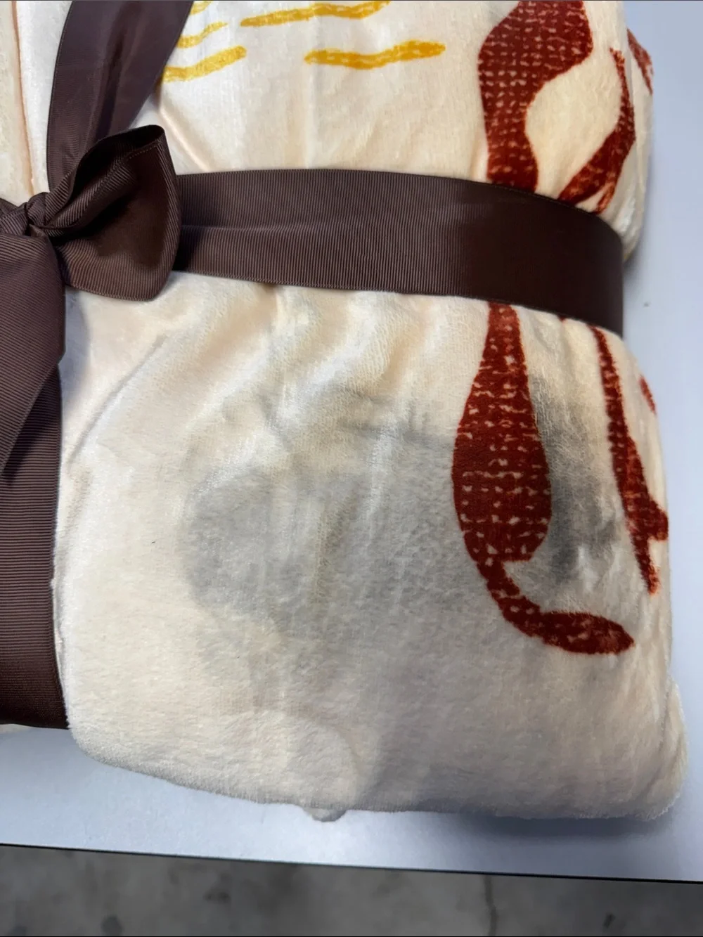 CAVENDER'S Rust & Gold Desert Cowboy Plush Throw