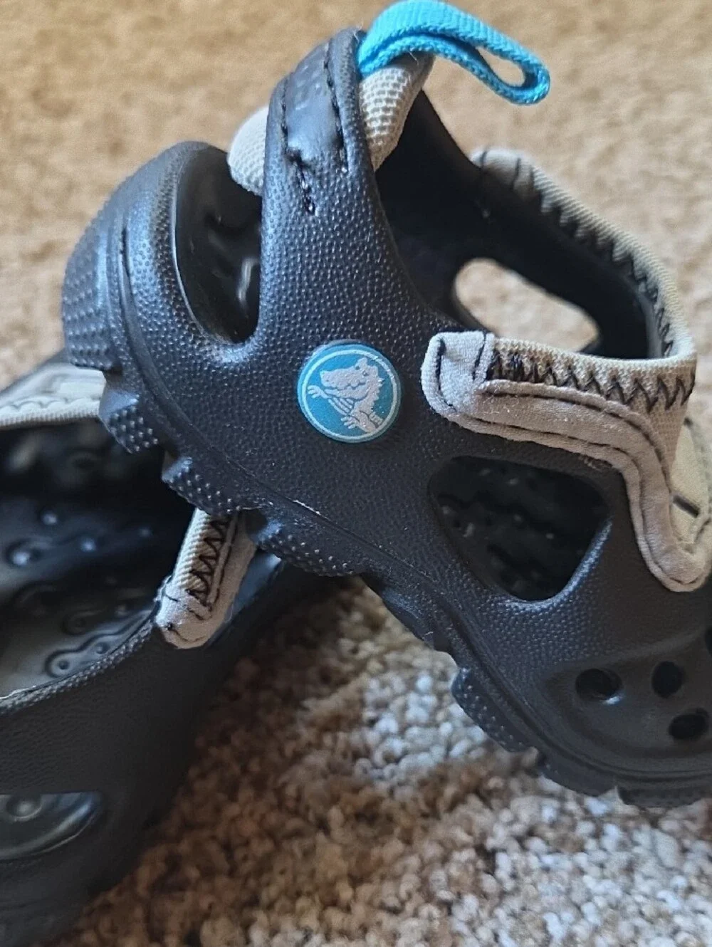 CROCS Kids Black and Beige Clog with Bright Blue Pull Tabs and Charms