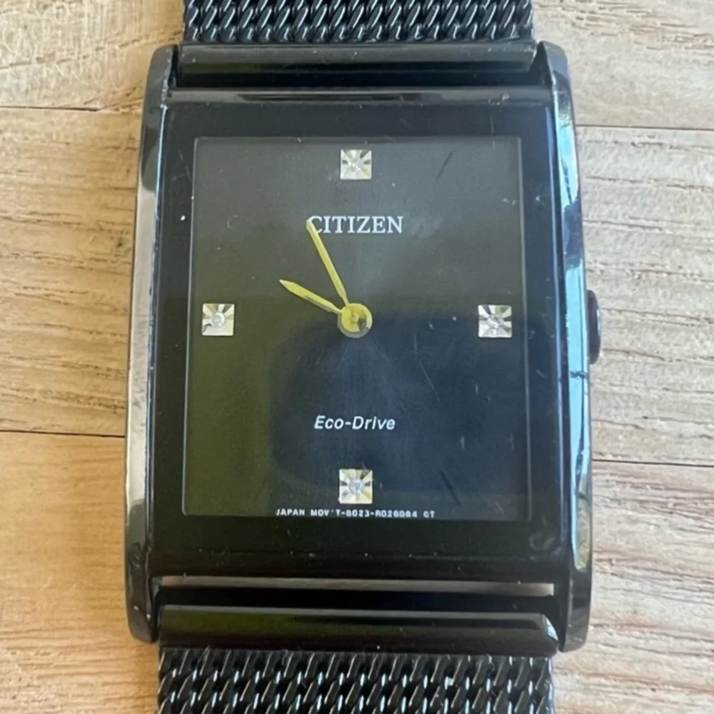 Citizen Eco-drive mens axiom black dial rectangular dress watch