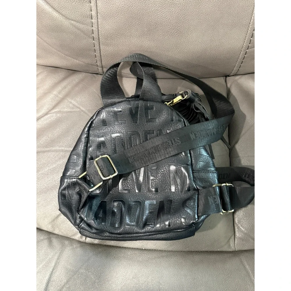 Steve Madden Black Embossed Logo Mini Backpack‎ Convertible Strap Tassel Detail