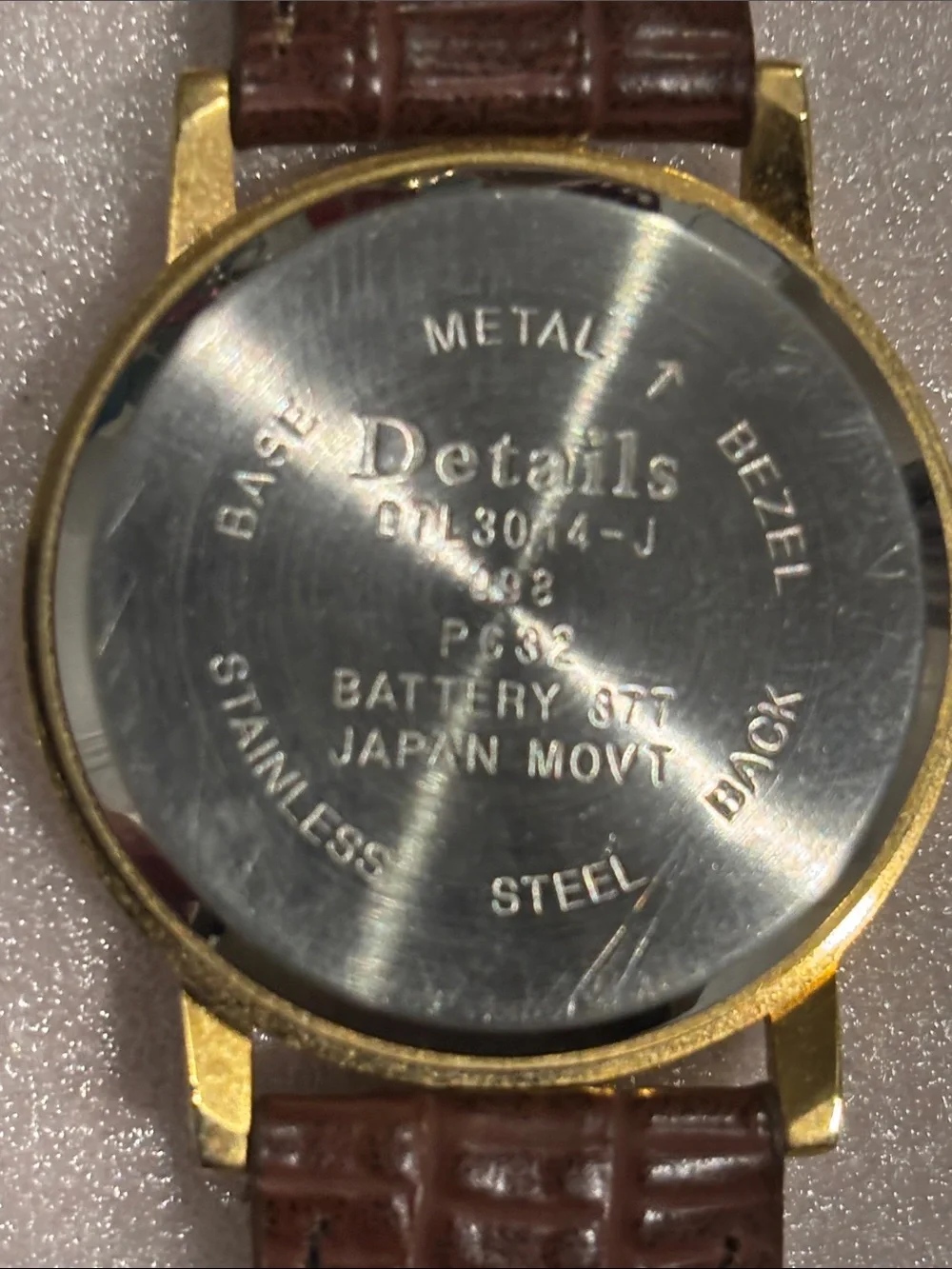 Gold-Tone Round Watch with Silver Dial and Brown Leather Strap