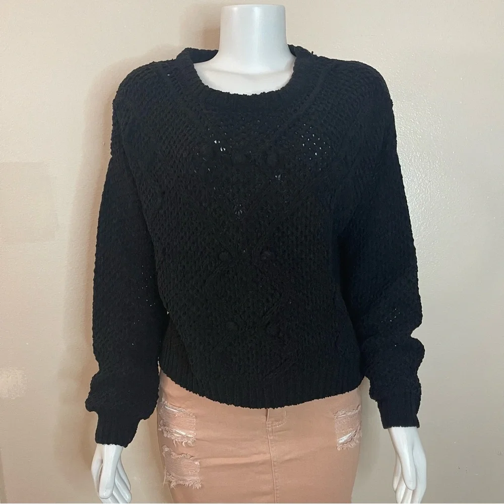 Black crew neck dropped shoulders ribbed trims knit sweater